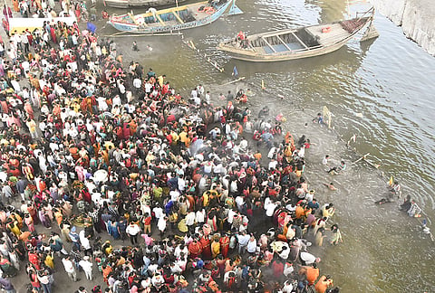 Devotees gather at the banks of the Ganga river to offer prayers during the ‘Chaiti Chhath’ festival, in Patna.
