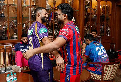 Indian Premier League team captains Ajinkya Rahane (Kolkata Knight Riders) and Rishabh Pant (Lucknow Super Giants) interact in Mumbai with other skippers in the background, ahead of the meeting with the Board of Control for Cricket in India.