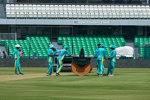 Groundsmen work at the at the Gaddafi Stadium in preparations for upcoming Pakistan's premier domestic T20 the Pakistan Super League, which will take place in empty stadiums due to the recent spike in oil prices, in Lahore, Pakistan.