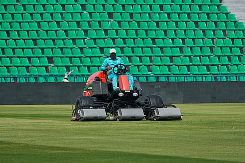 A groundsman works at the at the Gaddafi Stadium in preparations for upcoming Pakistan's premier domestic T20 the Pakistan Super League, which will take place in empty stadiums due to the recent spike in oil prices, in Lahore, Pakistan.