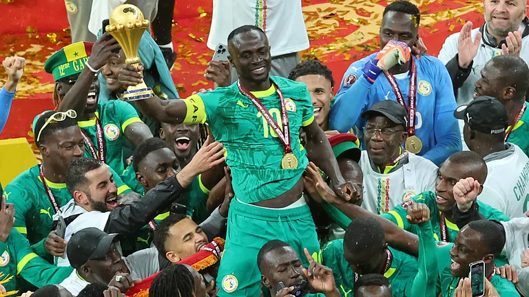 Senegal's Sadio Mane holds the trophy aloft as he celebrates with teammates after winning the Africa Cup of Nations final soccer match between Senegal and Morocco in Rabat, Morocco, Sunday, Jan. 18, 2026. - | Photo: AP/Youssef Loulidi