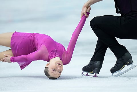 Ioulia Chtchetinina and Michal Wozniak from Poland perform during the pairs short program at the Figure Skating World Championships in Prague, Czech Republic.