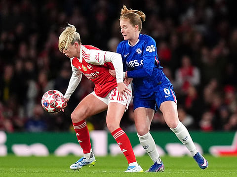 Arsenal's Alessia Russo, left, and Chelsea's Sjoeke Nusken battle for the ball during the Women's Champions League match in London.