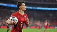 Turkiye Vs North Macedonia LIVE Score, International Friendly: Crescent-Stars Favourites In Istanbul Warm-Up | Photo: AP : Turkey's Arda Guler grabs the ball during the 2026 World Cup playoff semifinal soccer match between Turkey and Romania, in Istanbul, Turkey, Thursday, March 26, 2026