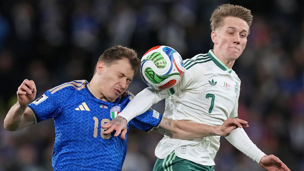 Italy's Nicolo Barella, left, and Northern Ireland's Ethan Galbraith vie for the ball during the World Cup qualifying play-off soccer match. - Antonio Calanni/AP