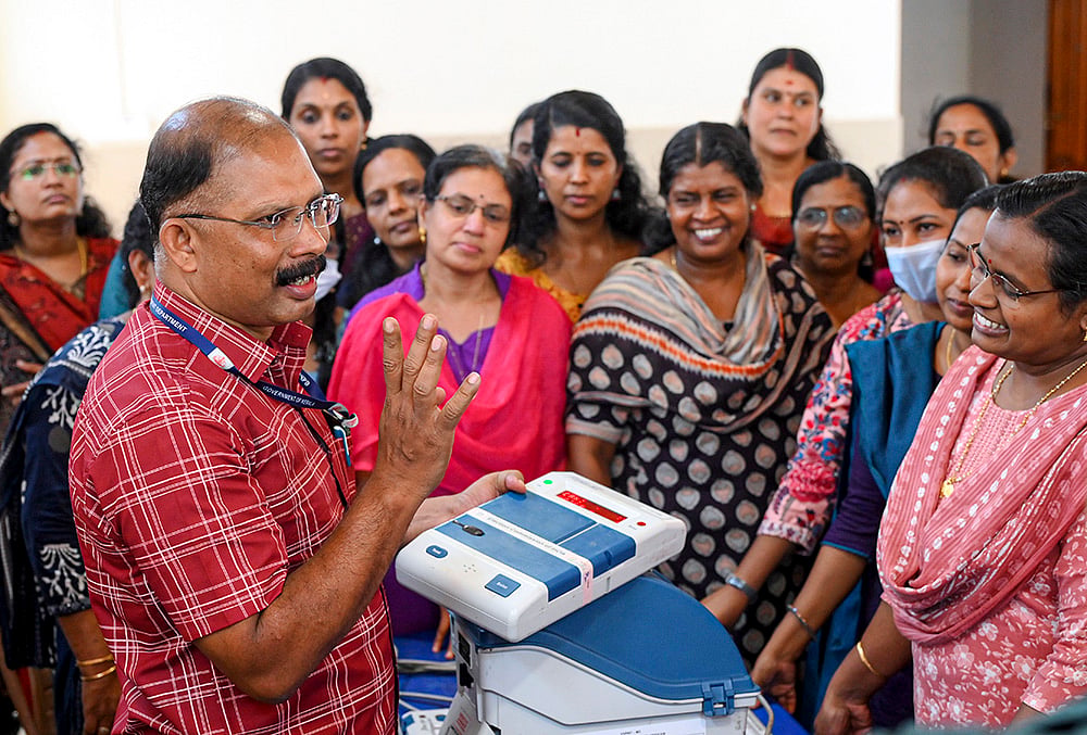 | Photo: PTI : A polling official demonstrates the operation of EVM and VVPAT units during a training programme ahead of the Kerala Legislative Assembly Elections, in Thiruvananthapuram, Kerala.