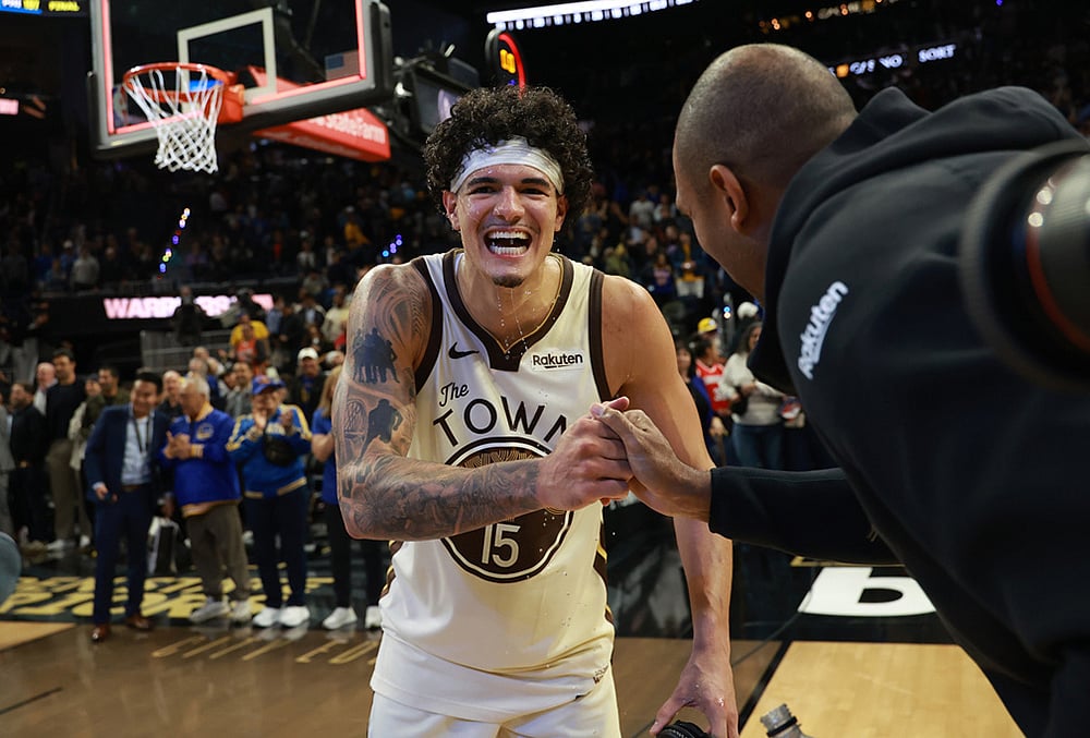 Golden State Warriors forward Gui Santos (15) celebrates with teammate Al Horford, right, after an NBA basketball game against the Brooklyn Nets in San Francisco. - | Photo: AP/Jed Jacobsohn