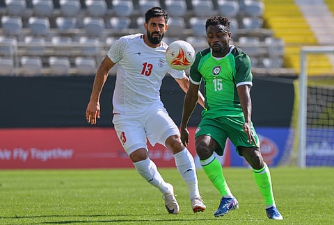 Nigeria's Moses Simon, right, vies for the ball with Iran's Hossein Kanaanizadegan during a friendly soccer match between Iran and Nigeria in Antalya, southern Turkey.