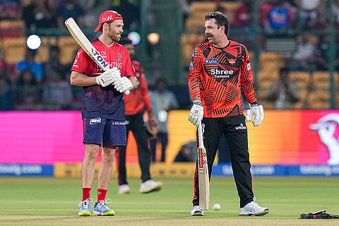 Royal Challengers Bengaluru's Phil Salt, left, and Sunrisers Hyderabad's Travis Head during a practice session before an Indian Premier League (IPL) 2026 T20 cricket match between Royal Challengers Bengaluru and Sunrisers Hyderabad, at the M Chinnaswamy Stadium, in Bengaluru, Karnataka.