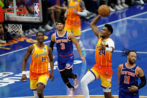 Charlotte Hornets forward Brandon Miller (24) drives for a dunk ahead of New York Knicks guard Jalen Brunson (11) as Hornets forward Moussa Diabate (14) and Knicks guard Josh Hart (3) follow during the second half of an NBA basketball game in Charlotte, N.C.