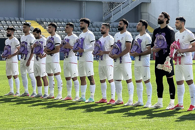 The Iranian national team, National team players appear at the ceremony wearing black armbands and carrying girls school backpacks to protest the bombing of Shajareh Tayyebeh girls elementary school in Minab and the US-Israel strikes in Iran ahead of the friendly match between Iran and Nigeria at the Mardan Sports Complex in Antalya, Turkiye - | Photo: IMAGO/Stringer