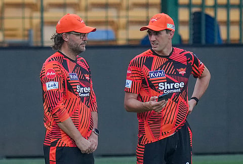 Sunrisers Hyderabad’s coach Daniel Vettori, left, and Pat Cummins during a practice session on the eve of the Indian Premier League (IPL) 2026 cricket match against Royal Challengers Bengaluru, at M Chinnaswamy Stadium in Bengaluru, Karnataka.