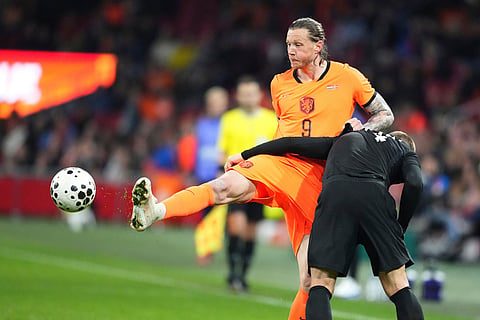 Norway's Julian Ryerson, right, and Netherlands' Wout Weghorst challenge for the ball the international friendly soccer match between the Netherlands and Norway in Amsterdam, Netherlands,.