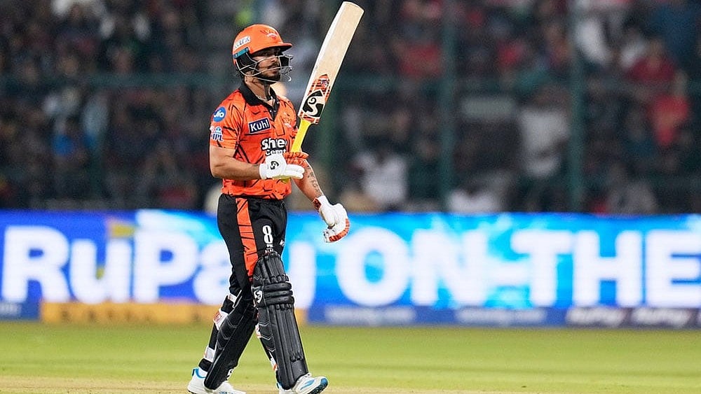 | Photo: AP/Aijaz Rahi : Sunrisers Hyderabad's captain Ishan Kishan celebrates his fifty runs during the Indian Premier League cricket match between Royal Challengers Bengaluru and Sunrisers Hyderabad in Bengaluru, India.