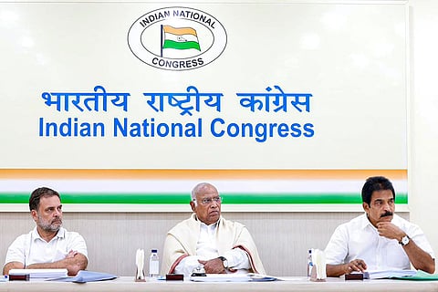 In this image released on March 28, 2026, Congress President Mallikarjun Kharge, centre, and party leaders Rahul Gandhi, left, and KC Venugopal during the party's 'Central Election Committee (CEC)' meeting ahead of the West Bengal Assembly elections, in New Delhi.