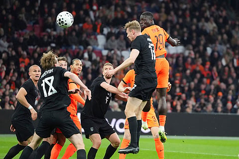 Netherlands' Brian Brobbey, right, and Norway's Torbjorn Heggem challenge for the ball during the international friendly soccer match between the Netherlands and Norway in Amsterdam, Netherlands.
