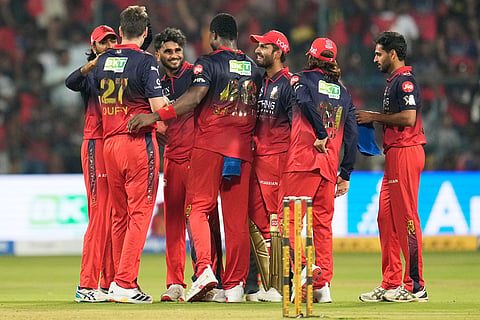 Royal Challengers Bengaluru's Abhinandan Singh, third left, celebrates with teammates after taking the catch to dismiss Sunrisers Hyderabad's Nitish Kumar Reddy during the Indian Premier League cricket match between Royal Challengers Bengaluru and Sunrisers Hyderabad in Bengaluru, India.