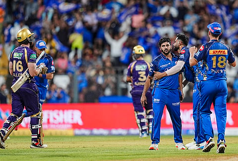 Mumbai Indians' Shardul Thakur, third right, celebrates with teammates after taking the wicket of Kolkata Knight Riders' Finn Allen during an Indian Premier League (IPL) 2026 T20 cricket match between Mumbai Indians and Kolkata Knight Riders, at the Wankhede Stadium, in Mumbai, Maharashtra.