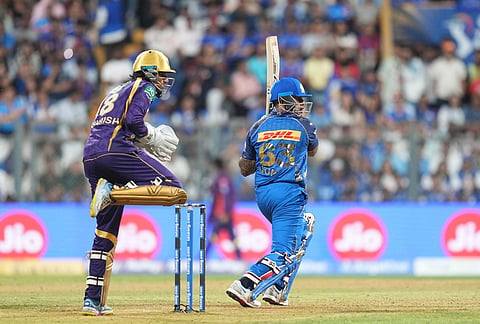 Mumbai Indians' Suryakumar Yadav plays a shot during the Indian Premier League cricket match between Mumbai Indians and Kolkata Knight Riders in Mumbai.
