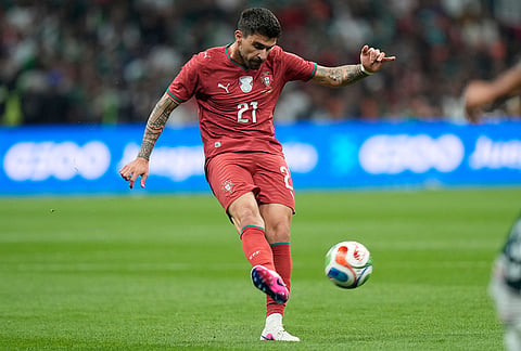 Portugal's Ruben Neves passes the ball during the international friendly soccer match between Mexico and Portugal in Mexico City.
