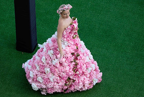 A racegoer arrives at the Meydan Racecourse ahead of the Dubai World Cup, United Arab Emirates.