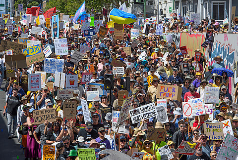 Demonstrators march during the "No Kings" protest in Oakland, California.