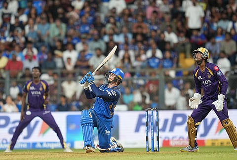 Mumbai Indians' Ryan Rickelton plays a shot during the Indian Premier League cricket match between Mumbai Indians and Kolkata Knight Riders in Mumbai.