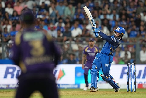 Mumbai Indians' Ryan Rickelton plays a shot during the Indian Premier League cricket match between Mumbai Indians and Kolkata Knight Riders in Mumbai.