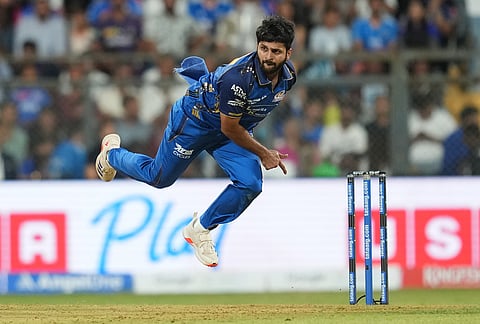 Mumbai Indians' Shardul Thakur bowls a delivery during the Indian Premier League cricket match between Mumbai Indians and Kolkata Knight Riders in Mumbai.