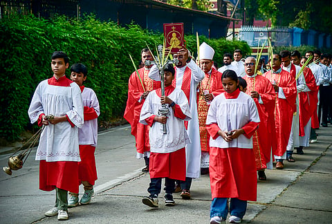 Christians take part in a procession at the St. Joseph's Cathedral Church on the occassion of Palm Sunday, in Prayagraj, Uttar Pradesh. Palm Sunday marks the beginning of Holy Week and commemorates the entry of Jesus Christ into Jerusalem. 