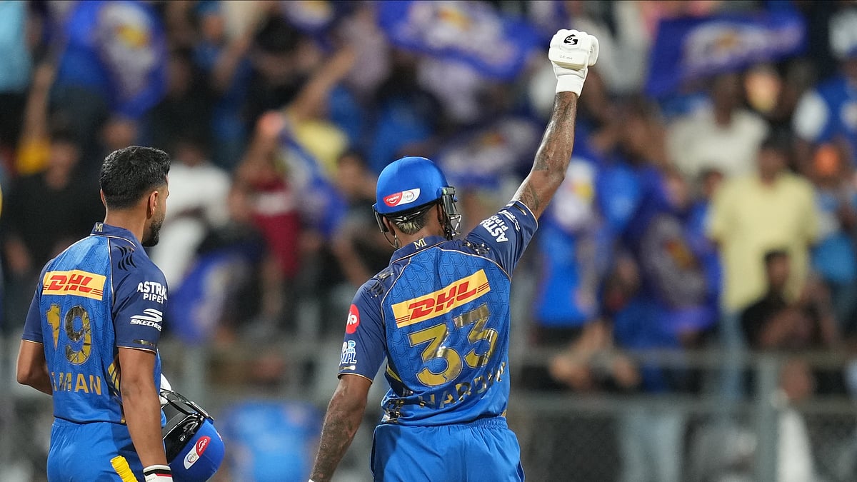 (AP Photo/Rafiq Maqbool) : Mumbai Indians' captain Hardik Pandya, right, and Naman Dhir celebrate after won the match during the Indian Premier League cricket match between Mumbai Indians and Kolkata Knight Riders in Mumbai, India, Sunday, March 29, 2026.