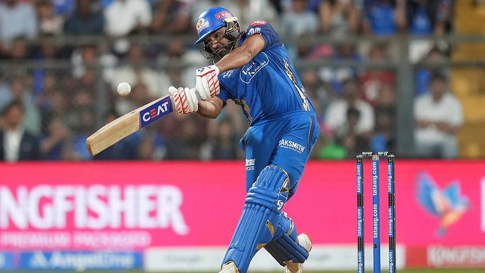 Mumbai Indians' Rohit Sharma plays a shot during the Indian Premier League cricket match between Mumbai Indians and Kolkata Knight Riders in Mumbai. - | Photo: AP/Rafiq Maqbool