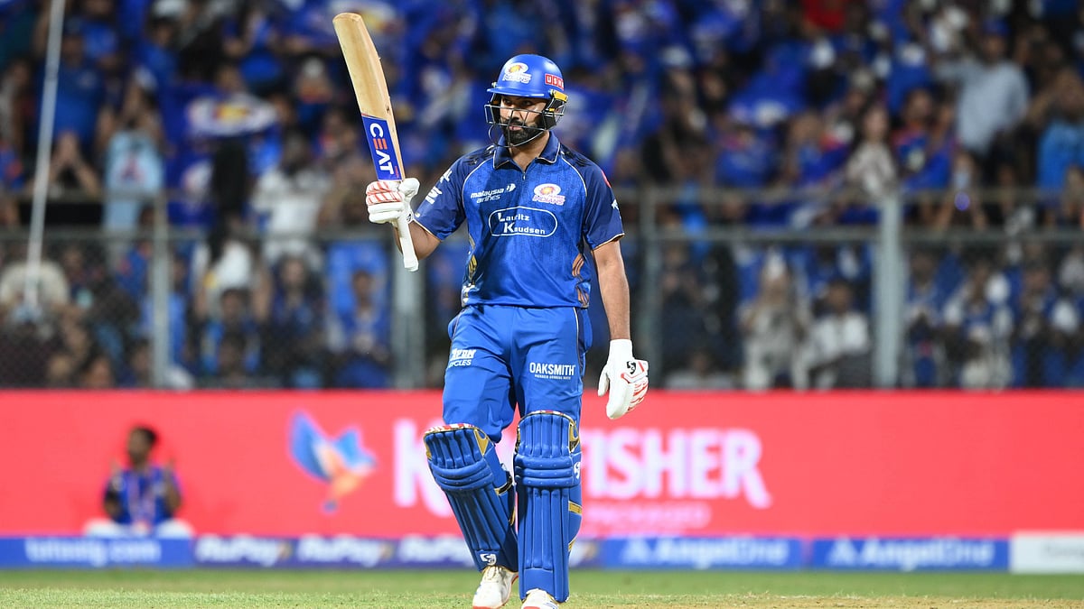 ipl/X : Rohit Sharma celebrates his half-century against Kolkata Knight Riders at the Wankhede Stadium in Mumbai.