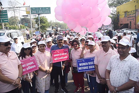 Bihar Rural Works Department Minister Ashok Choudhary and others participate in a walkathon to mark women empowerment, in Patna, Bihar.
