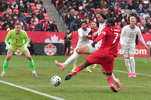 Canada's Jonathan David tries to square the ball despite pressure from Iceland's Sverrir Ingi Ingason during International friendly soccer action in Toronto.
