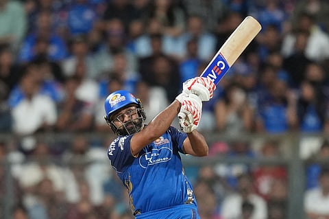 Mumbai Indians' Rohit Sharma plays a shot during the Indian Premier League cricket match between Mumbai Indians and Kolkata Knight Riders in Mumbai, India, Sunday, March 29, 2026. 