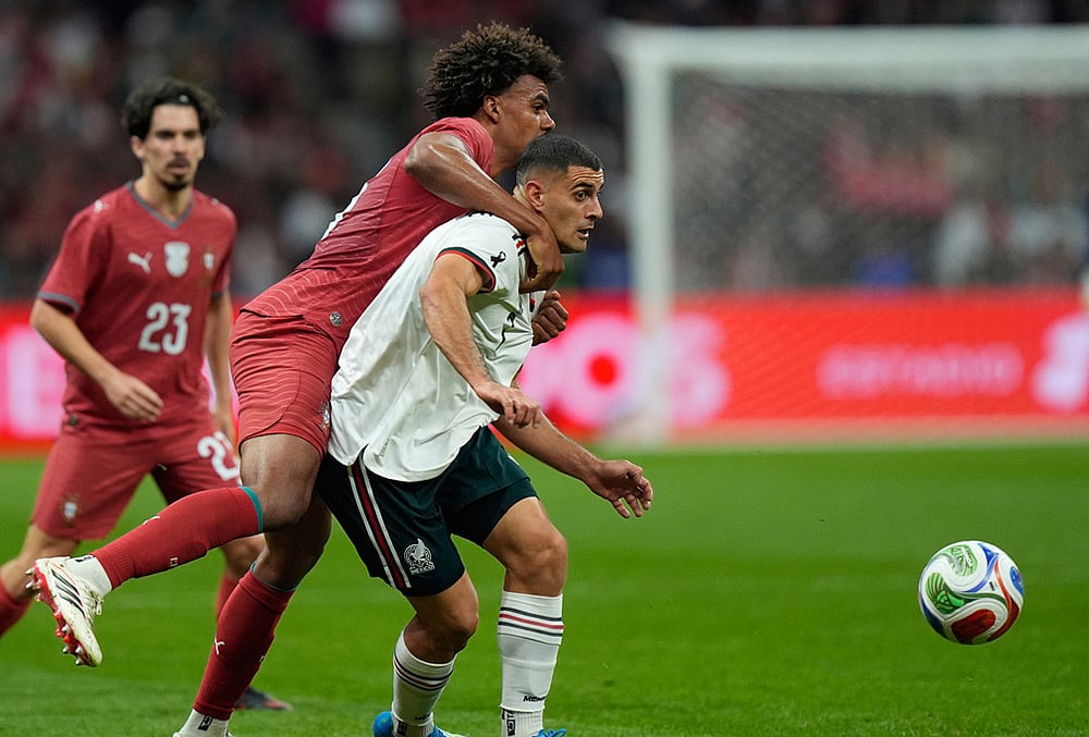 | Photo: AP/Fernando Llano : Mexico's German Berterame, right, is challenged by Portugal's Renato Veiga during the international friendly soccer match between Mexico and Portugal in Mexico City.