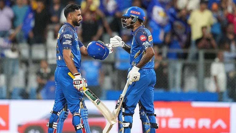 Mumbai Indians' captain Hardik Pandya, right, and Naman Dhir celebrate after won the match during the Indian Premier League cricket match between Mumbai Indians and Kolkata Knight Riders in Mumbai, India, Sunday, March 29, 2026 - AP Photo/Rafiq Maqbool