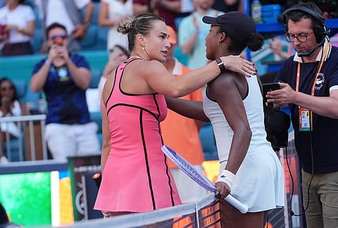 Aryna Sabalenka, left, and Coco Gauff embrace at the end of the women's singles final at the Miami Open tennis tournament, in Miami Gardens, Florida.
