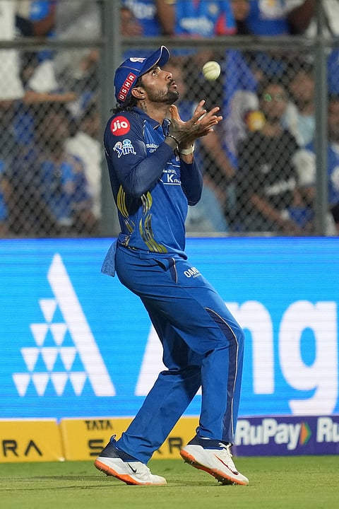 Mumbai Indians' Tilak Varma takes the catch to dismiss Kolkata Knight Riders' Angkrish Raghuvanshi during the Indian Premier League cricket match between Mumbai Indians and Kolkata Knight Riders in Mumbai.