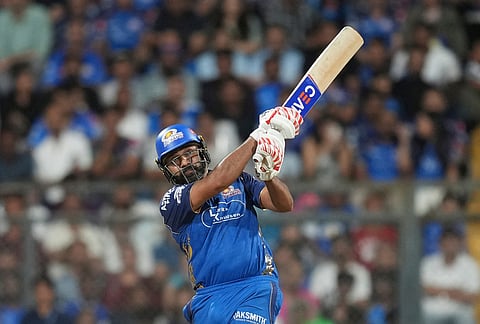 Mumbai Indians' Rohit Sharma plays a shot during the Indian Premier League cricket match between Mumbai Indians and Kolkata Knight Riders in Mumbai.