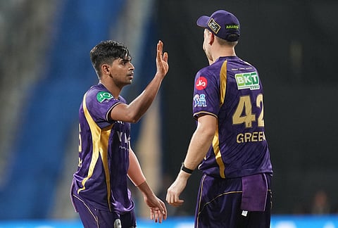 Kolkata Knight Riders' Kartik Tyagi, left, and Cameron Green celebrate the wicket of Mumbai Indians' Suryakumar Yadav during the Indian Premier League cricket match between Mumbai Indians and Kolkata Knight Riders in Mumbai.