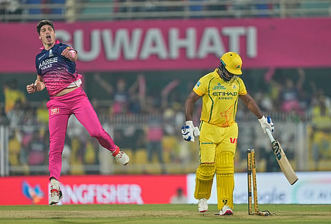 Rajasthan Royals's Nandre Burger, left, celebrates the wicket of Chennai Super Kings' Sanju Samson during the Indian Premier League cricket match between Chennai Super Kings and Rajasthan Royals in Guwahati.