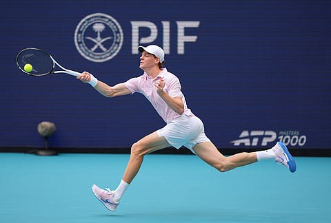 Jannik Sinner of Italy returns a ball against Jiri Lehecka of the Czech Republic in the men's singles final at the Miami Open tennis tournament, in Miami Gardens, Florida.