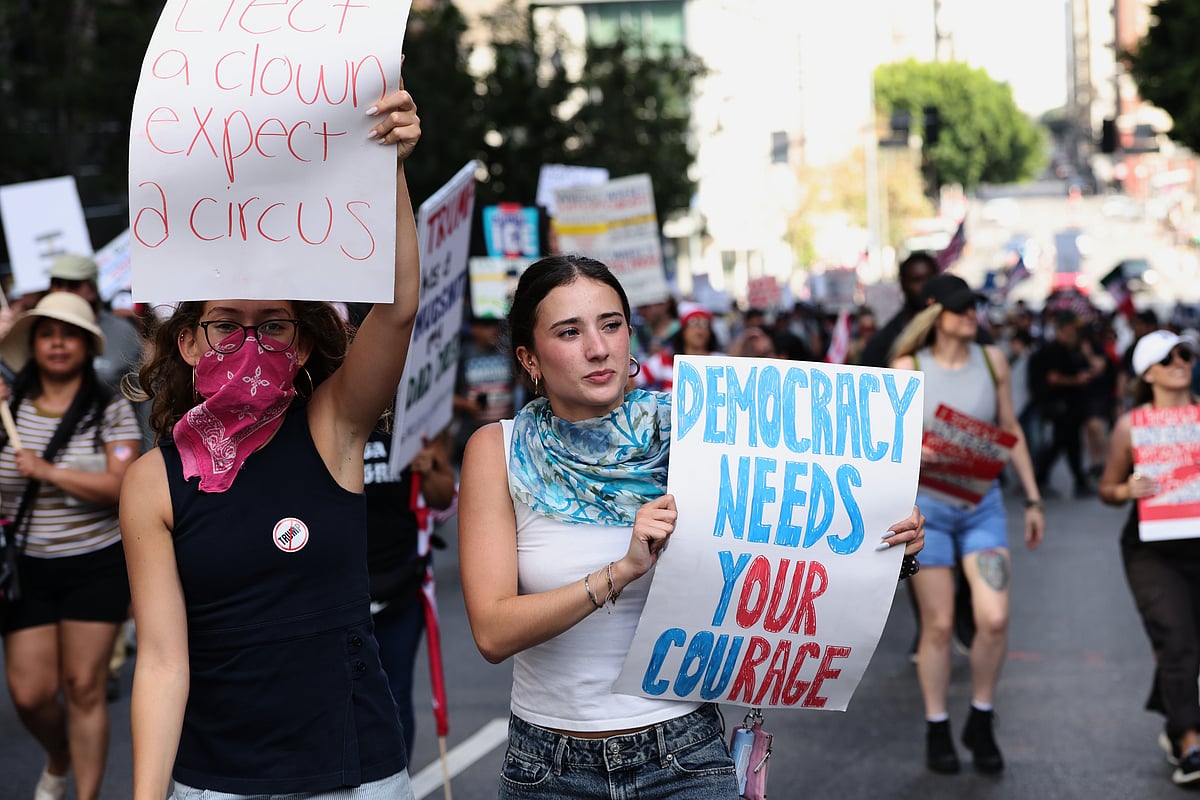 Source: AP
 : Demonstrators march through downtown Los Angeles during a "No Kings" protest Saturday, March 28, 2026. (AP Photo/Jill Connelly)