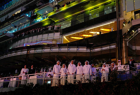 Emirati men watch Dubai World Cup horse races closing ceremony at Meydan Racecourse in Dubai, United Arab Emirates.
