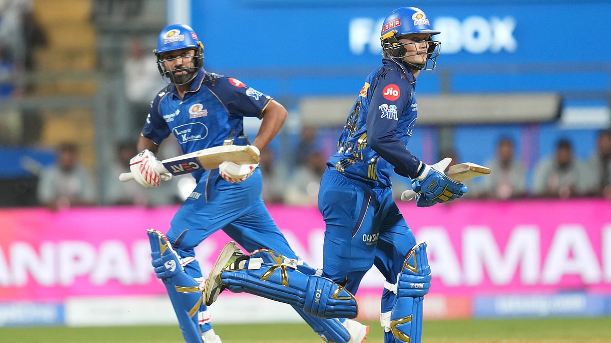 Mumbai Indians' Rohit Sharma, left, and Ryan Rickelton run between the wickets during the Indian Premier League cricket match between Mumbai Indians and Kolkata Knight Riders in Mumbai, India, Sunday, March 29, 2026. - | Photo: AP/Rafiq Maqbool