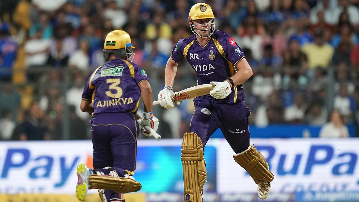 Kolkata Knight Riders' Cameron Green, right, and captain Ajinkya Rahane run between the wickets during the Indian Premier League cricket match between Mumbai Indians and Kolkata Knight Riders in Mumbai, India, Sunday, March 29, 2026 - (AP Photo/Rafiq Maqbool)