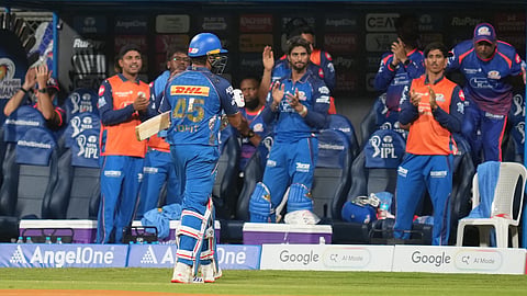 Mumbai Indians players applause Rohit Sharma during the Indian Premier League cricket match between Mumbai Indians and Kolkata Knight Riders in Mumbai, India, Sunday, March 29, 2026.