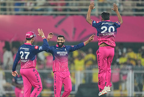 Rajasthan Royals' Ravindra Jadeja, center, celebrates with teammates the wicket of Chennai Super Kings' Shivam Dube during the Indian Premier League cricket match between Chennai Super Kings and Rajasthan Royals in Guwahati.